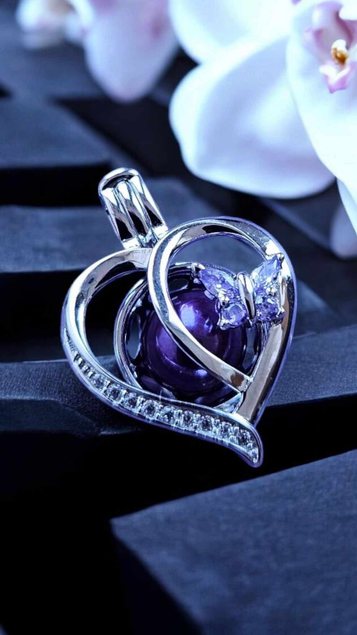 Sterling silver heart with butterfly pearl cage