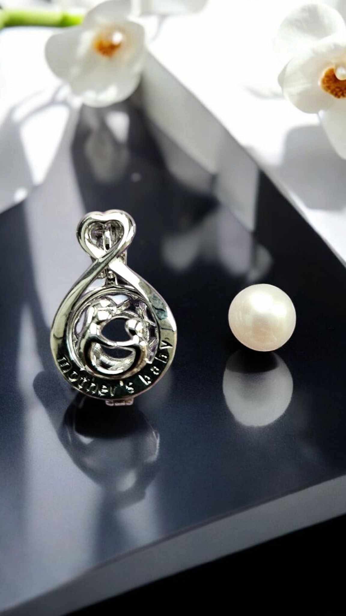 Sterling silver mother & baby pearl cage