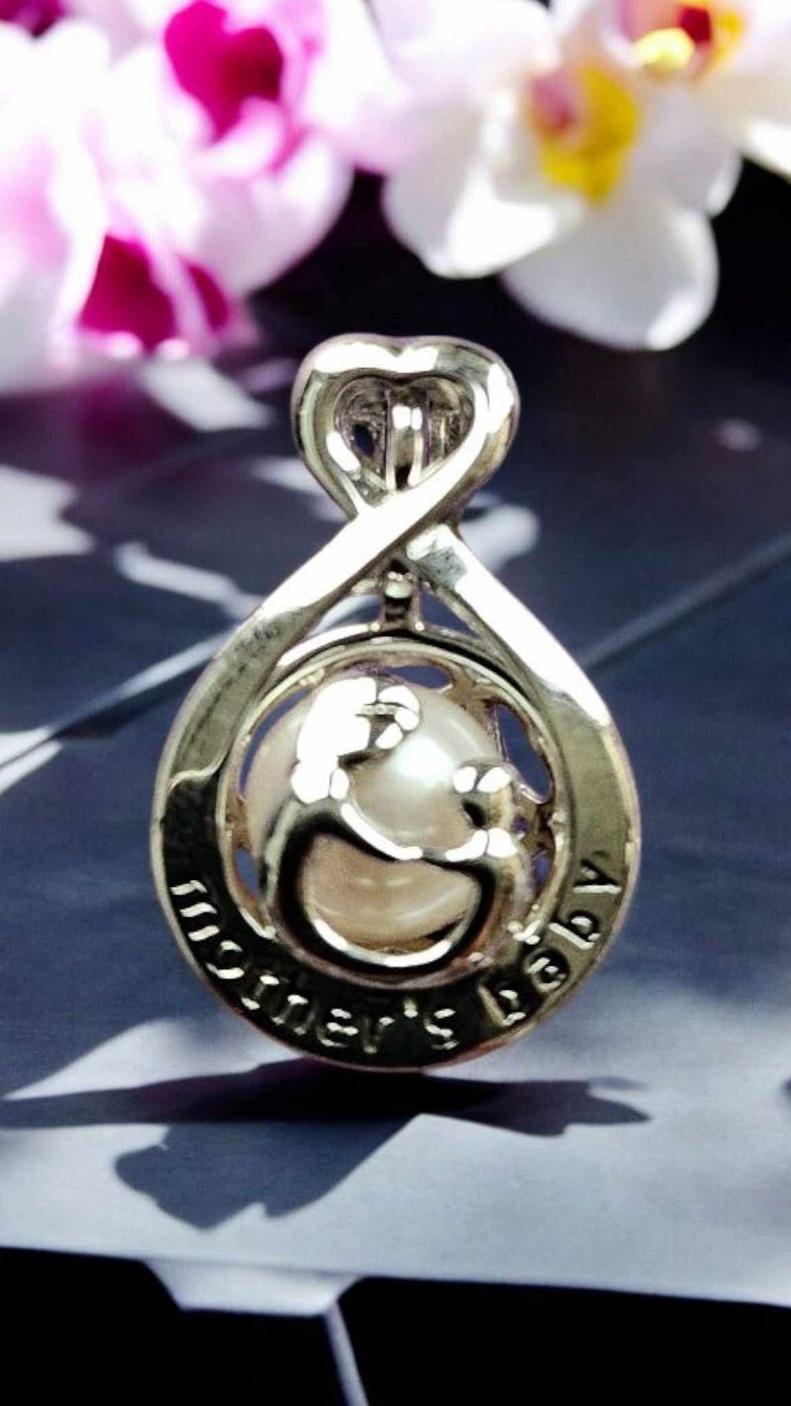 Sterling silver mother & baby pearl cage