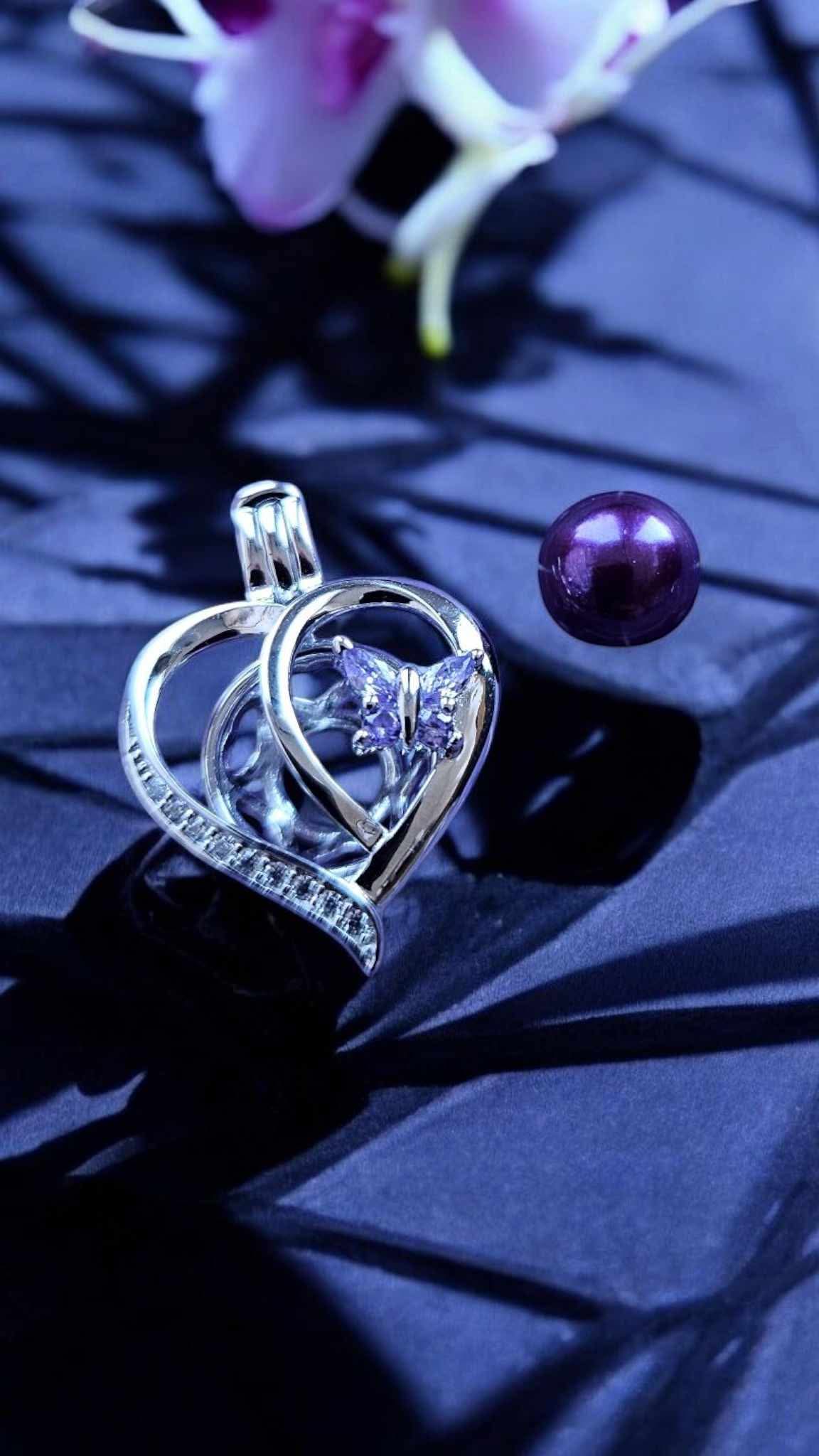 Sterling silver heart with butterfly pearl cage